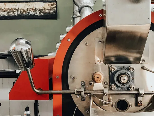 Roasted coffee beans being poured