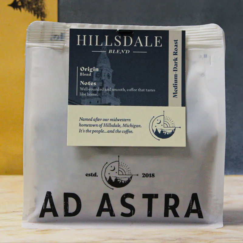 A bag of The Hillsdale Blend medium-dark roast coffee with its blue label