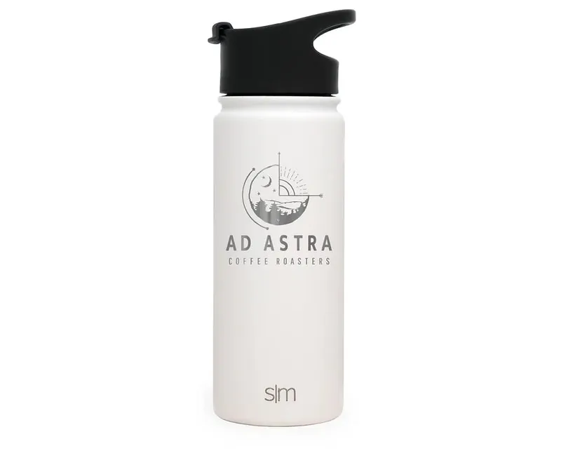 A white stainless steel travel mug etched with the Ad Astra logo